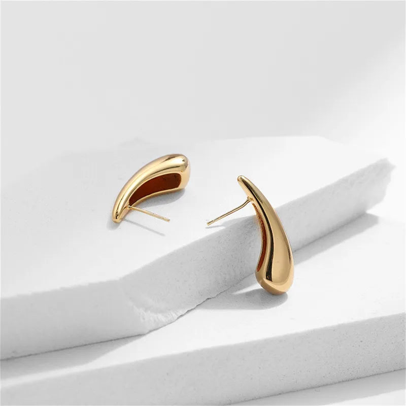 Sleek golden drop studs